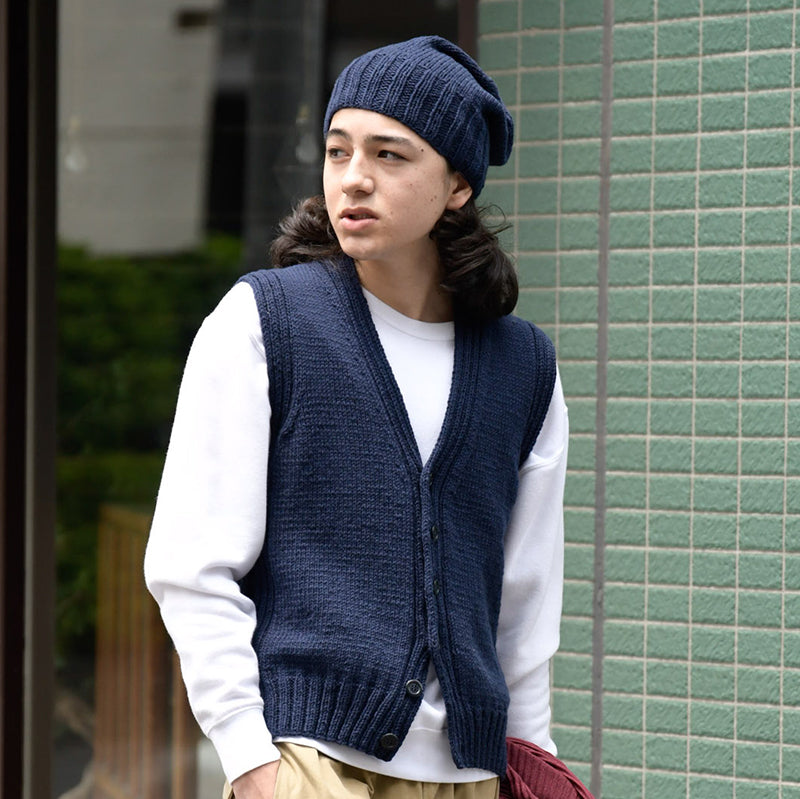 navy vest and hat