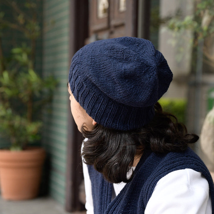 navy vest and hat