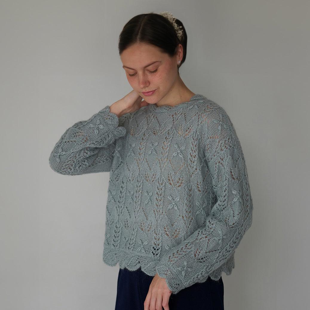 Scalloped pullover with flower and leaf pattern