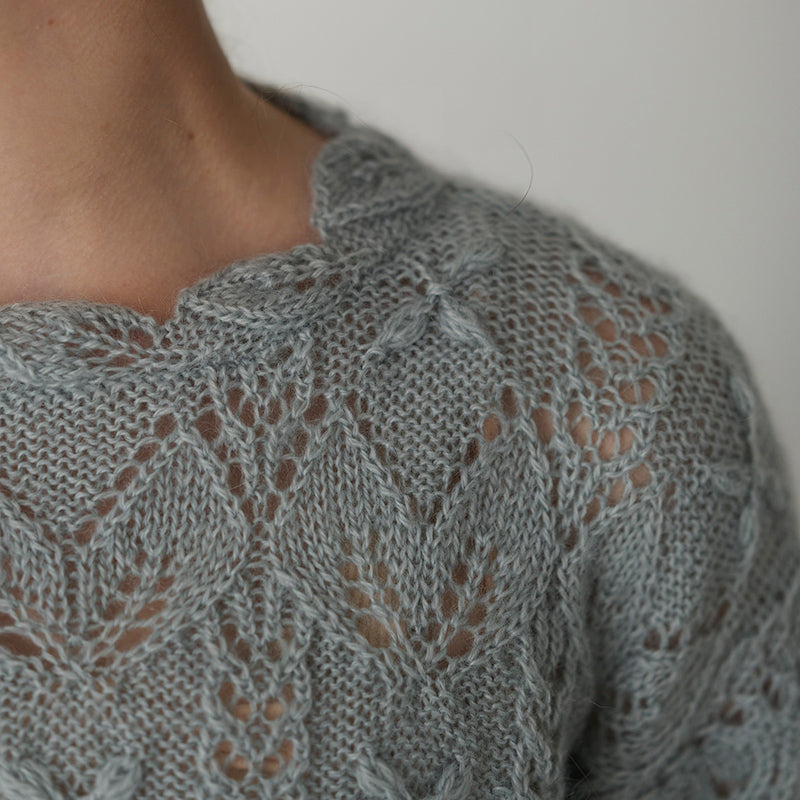 Scalloped pullover with flower and leaf pattern