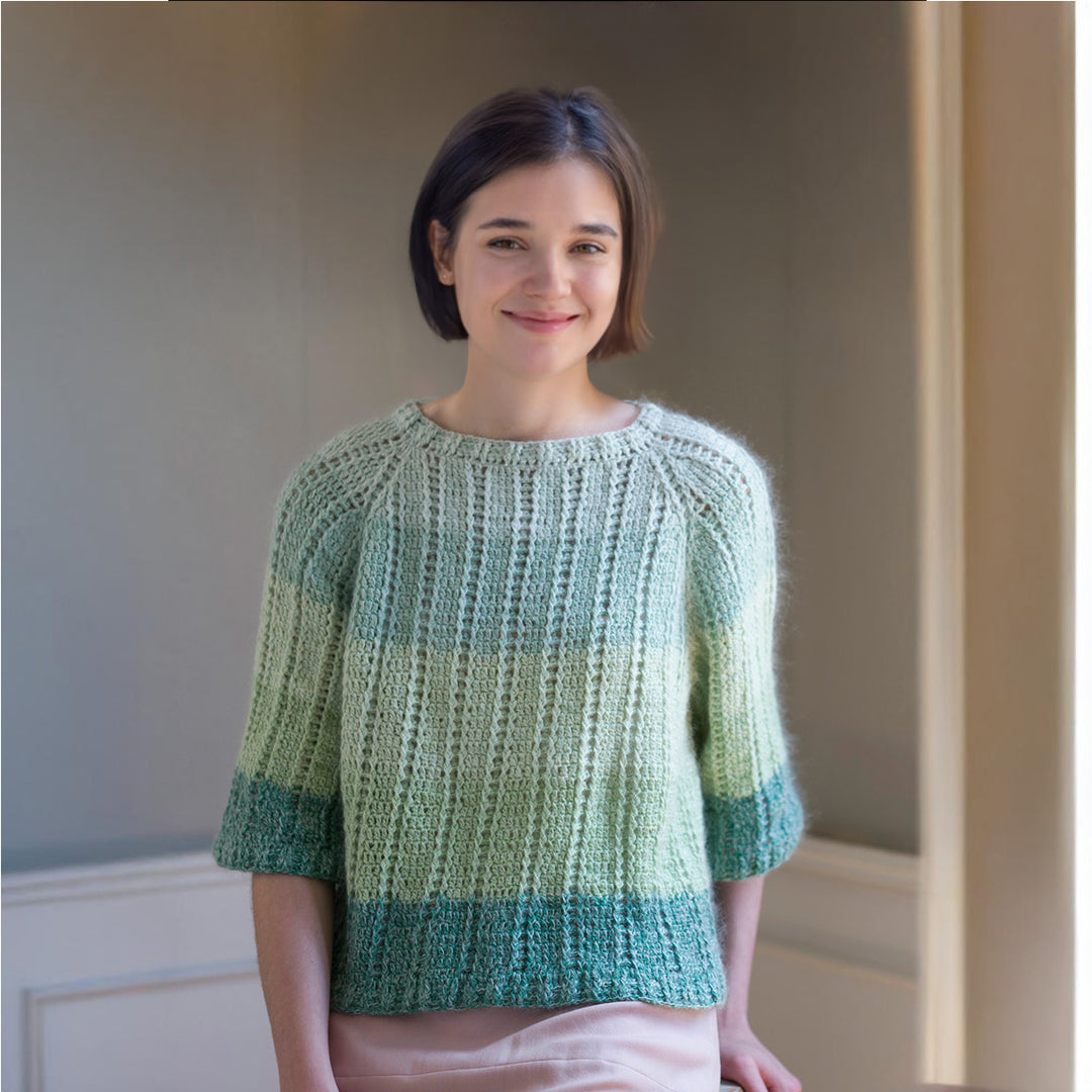 Green pullover knitted from the neck